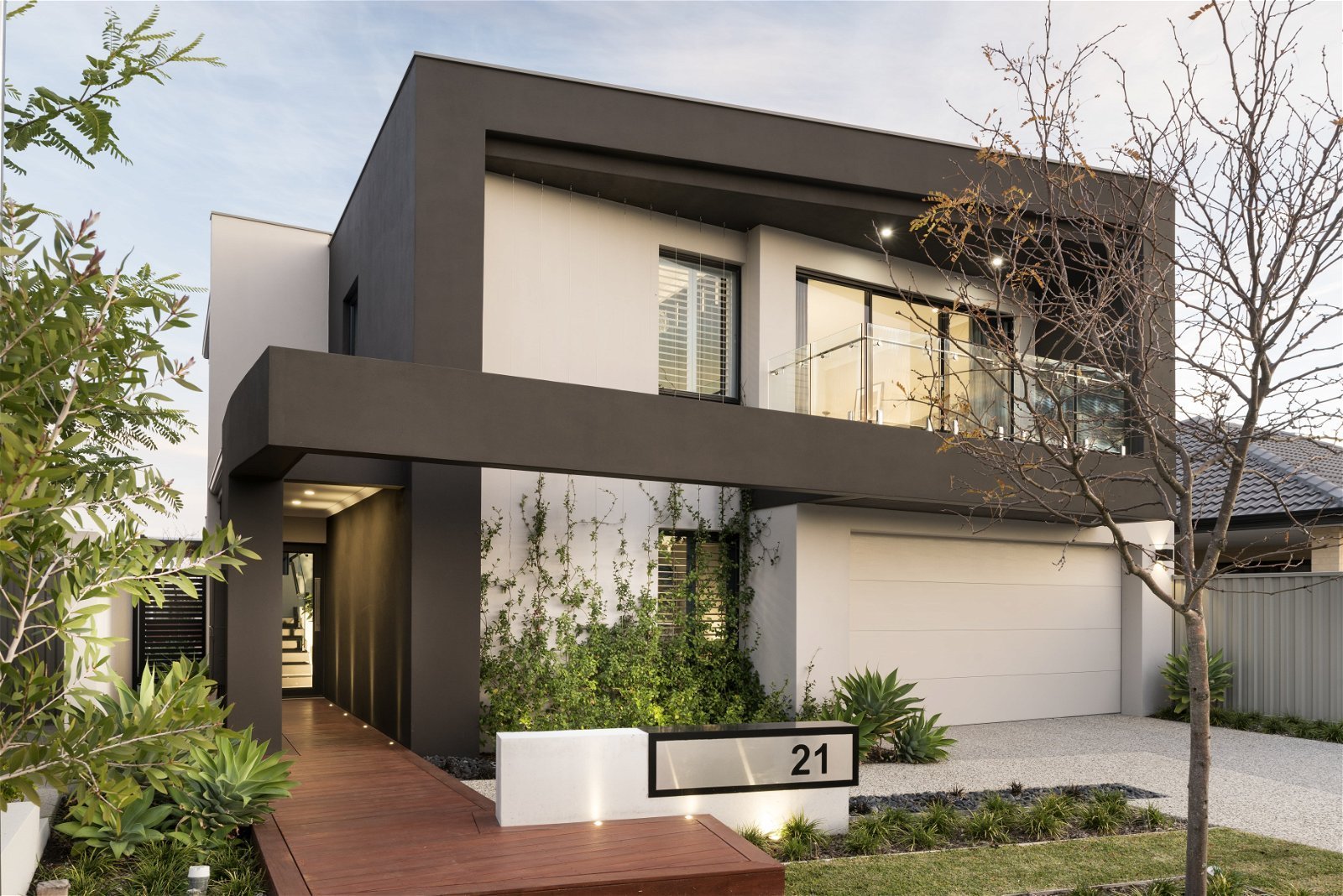 Street view of a modern four bed two bath two-storey home designed for a Perth residential lot. 